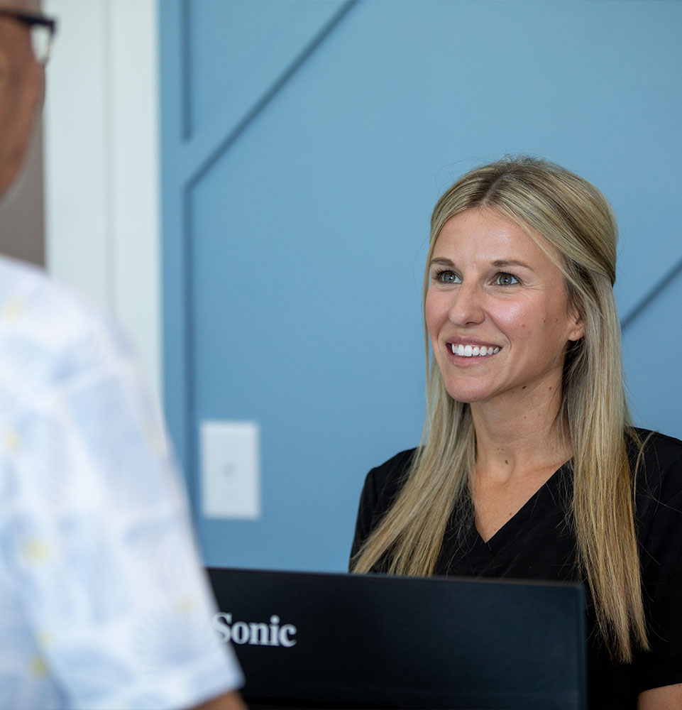 team member talking to patient